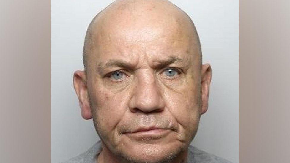 Mugshot of Michael Donaldson looking at the camera