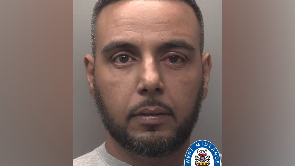 Police mugshot of Shazad Alam wearing a grey top