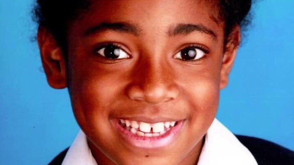 School photo of Ella Adoo-Kissi-Debrah in black and white uniform