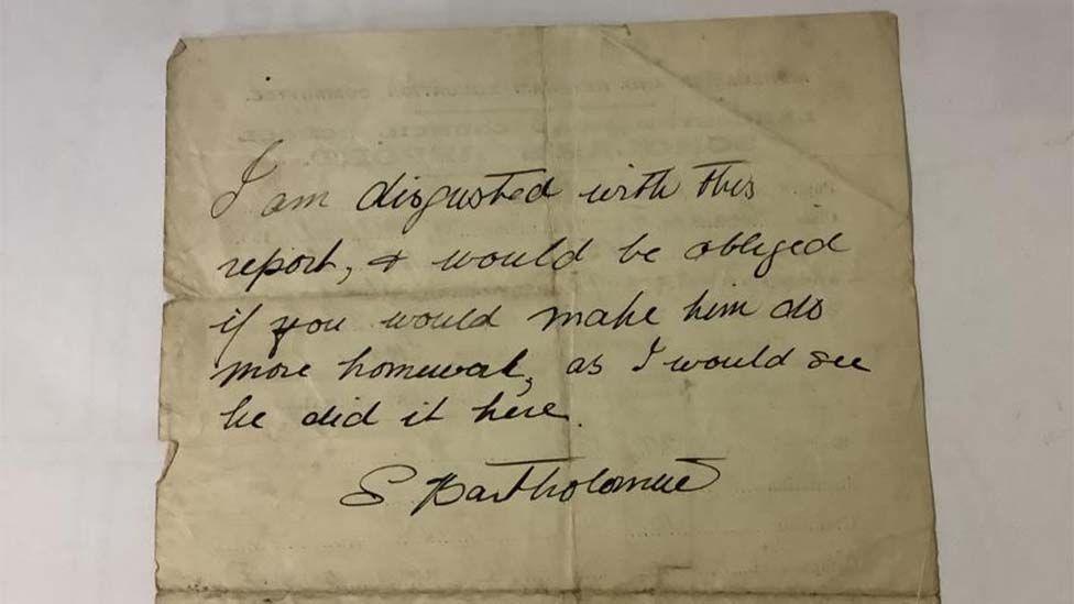 The back of the report with the handwritten note from Eric Morecambe's mother that reads "I am disgusted with this report and would be obliged if you would make him do more homework as I would see he did it here, S. Bartholomew."