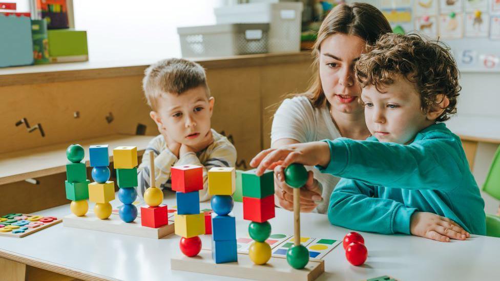 Children playing while receiving childcare