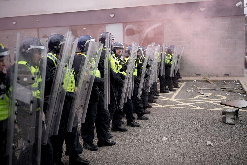 Riot police outside a Holiday Inn near Rotherham housing asylum seekers that was targeted during the disorder