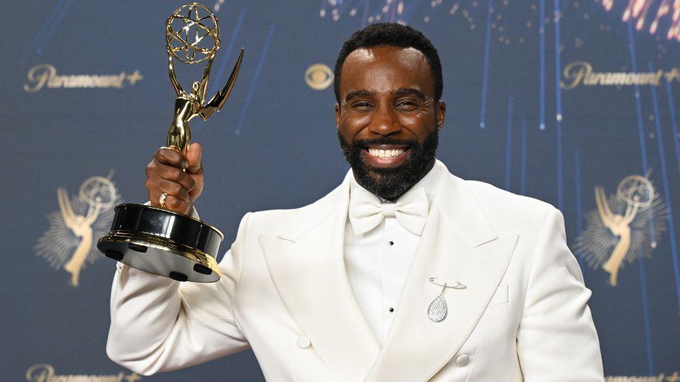 Tramell Tillman poses with the Supporting Actor in a Drama Series award for "Severance" at the 77th Primetime Emmy Awards held at the Peacock Theater on September 14, 2025 in Los Angeles, California