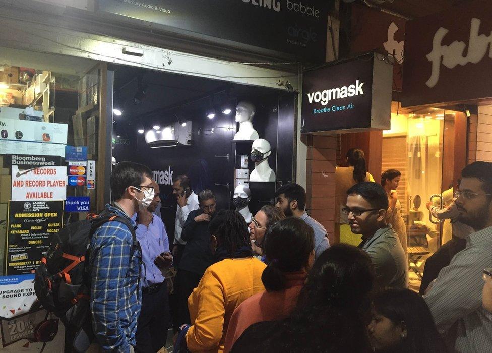 People queuing up at a face masks shop