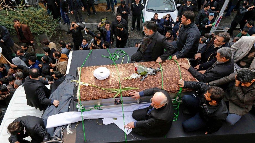 Iranians gather around a hearse carrying the coffin of Akbar Hashemi Rafsanjani in Tehran, Iran (10 January 2017)
