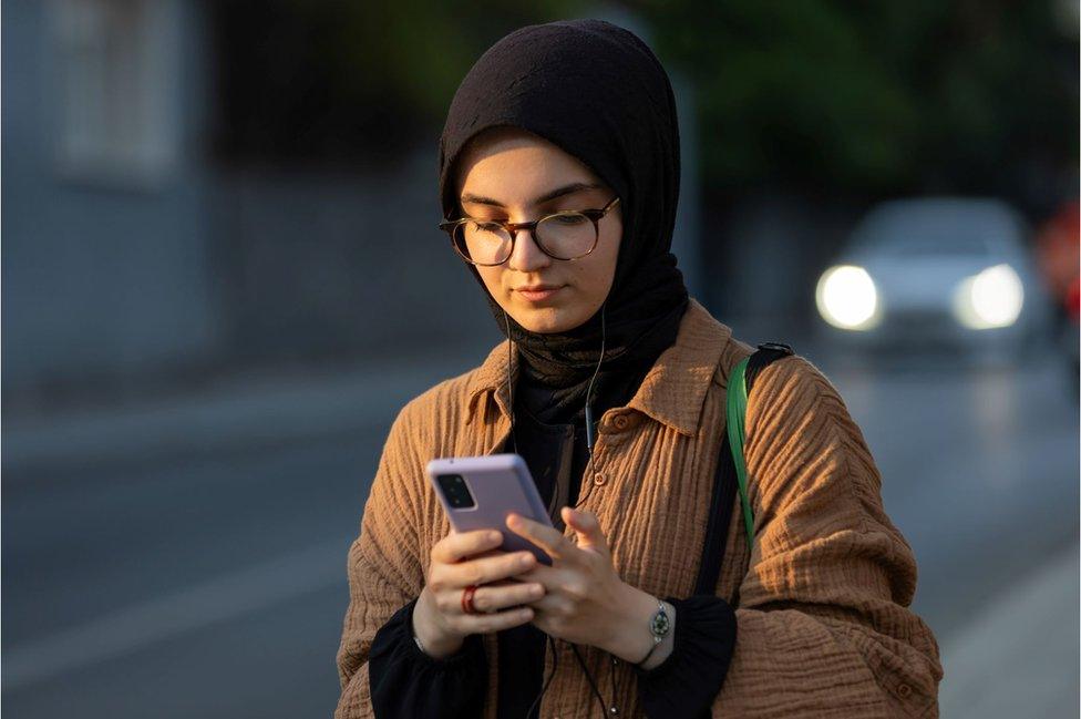 Muslim lady on a phone