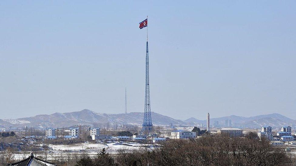 A North Korean flag flutters in the propaganda village of Gijeongdong