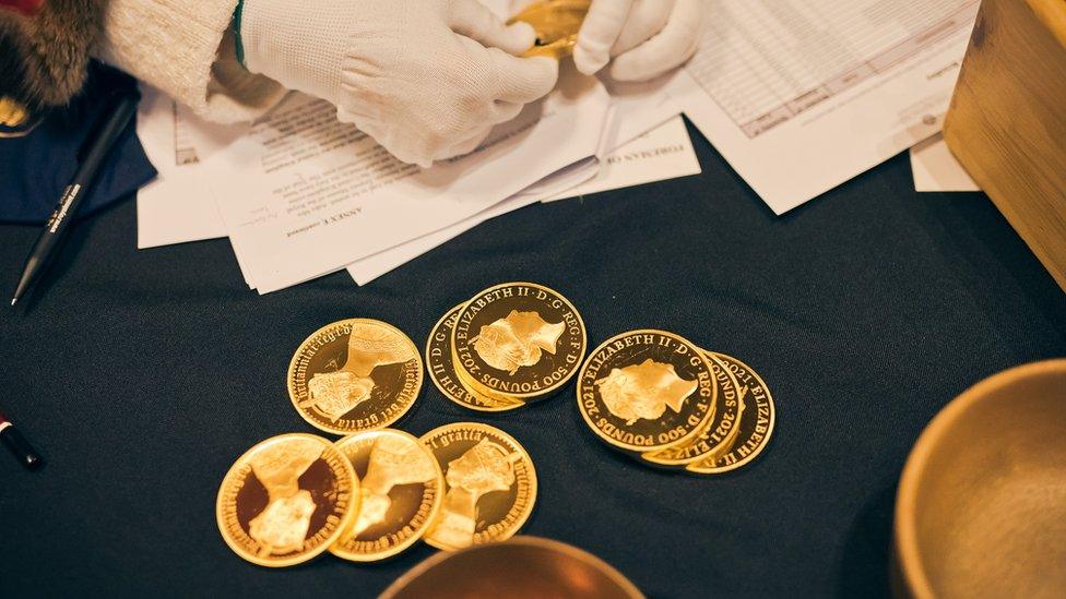 A selection of gold coins on trial