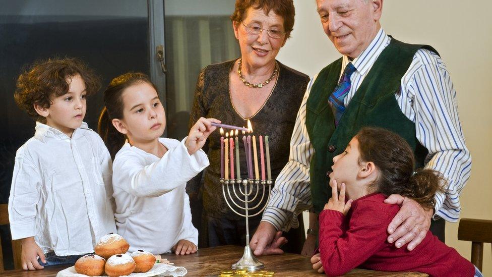 Family lighting candles