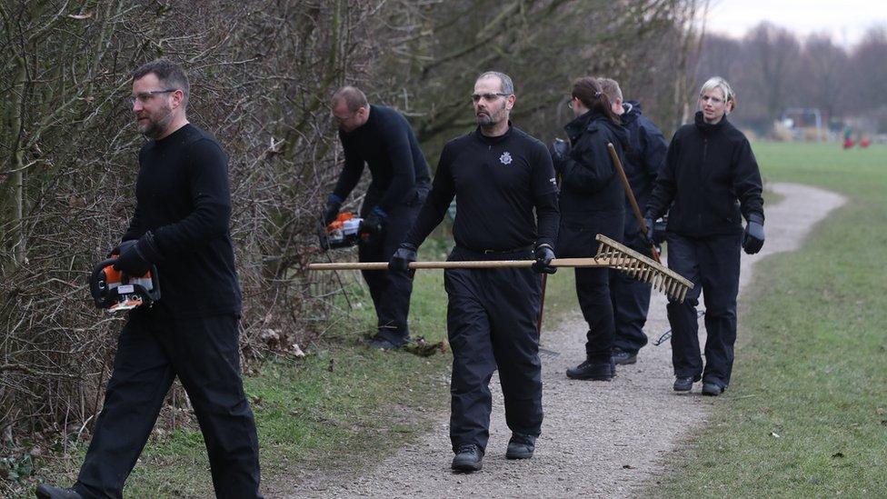 Police search an area near the Oak Road Playing Fields