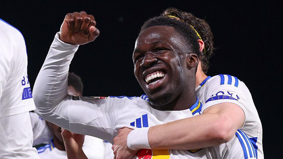 Willy Gnonto celebrates a goal with his fist in the air