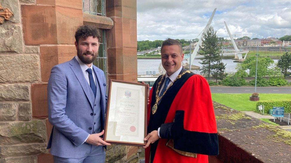 mayor of Derry conferring freedom of city on Danny Quigley at guildhall