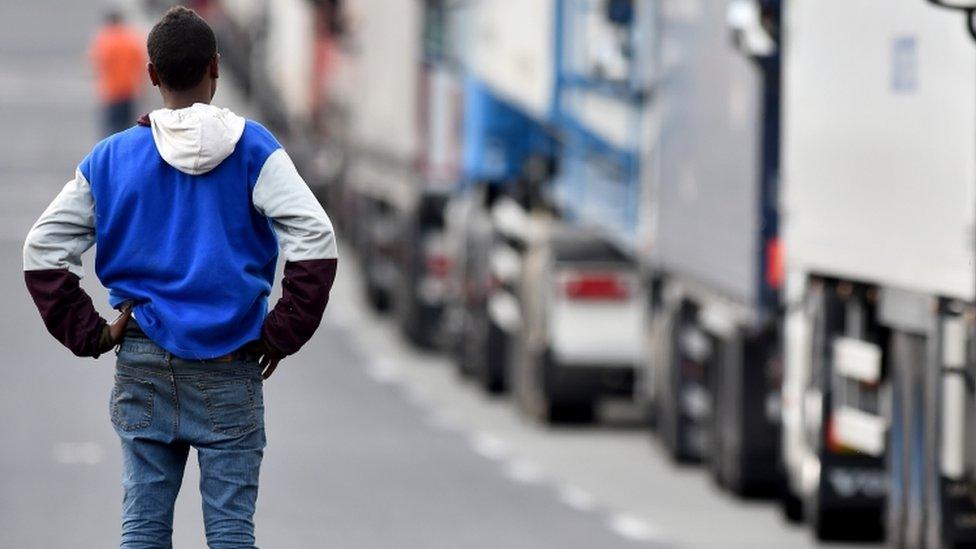 Migrant beside the road in Calais