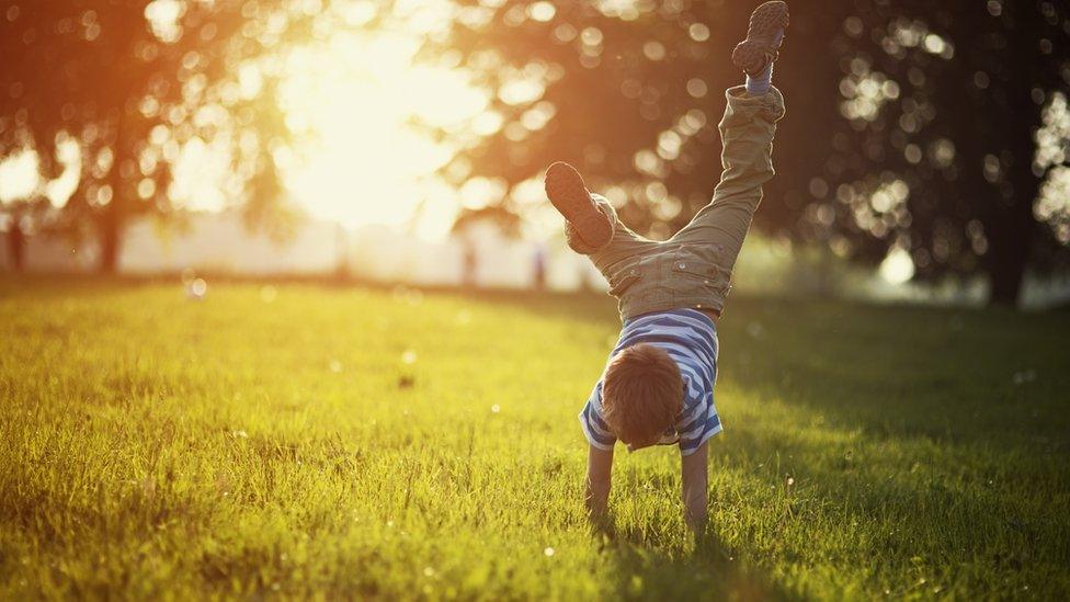 Child playing in the sun