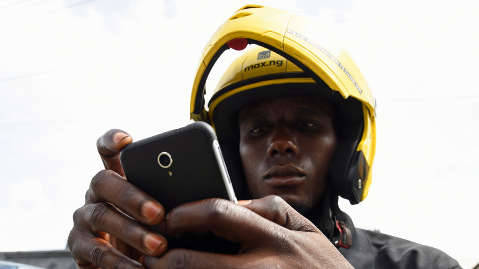 A motorbike taxi rider in Nigeria