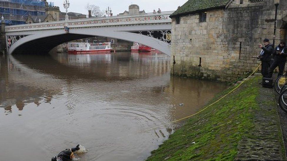 Police divers carry on their search of the River Ouse near Lendal.