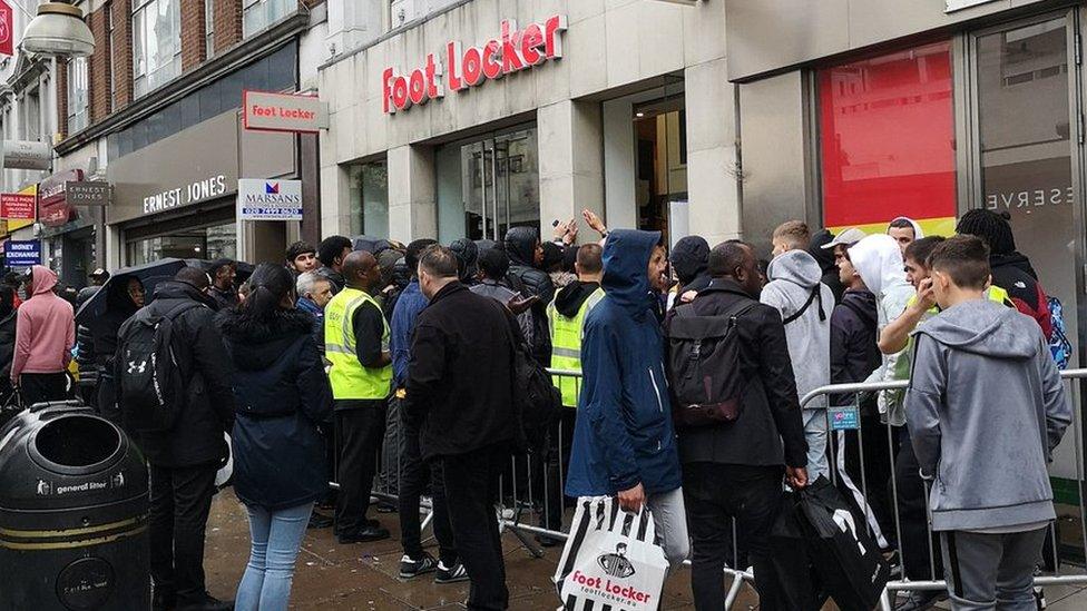 Yeezys Thousands queue through night for Kanye West trainers BBC News