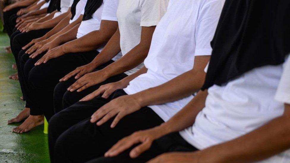 Female prisoners granted royal pardon attend a ceremony at the Narathiwat provincial jail in Thailand's southern province of Narathiwat