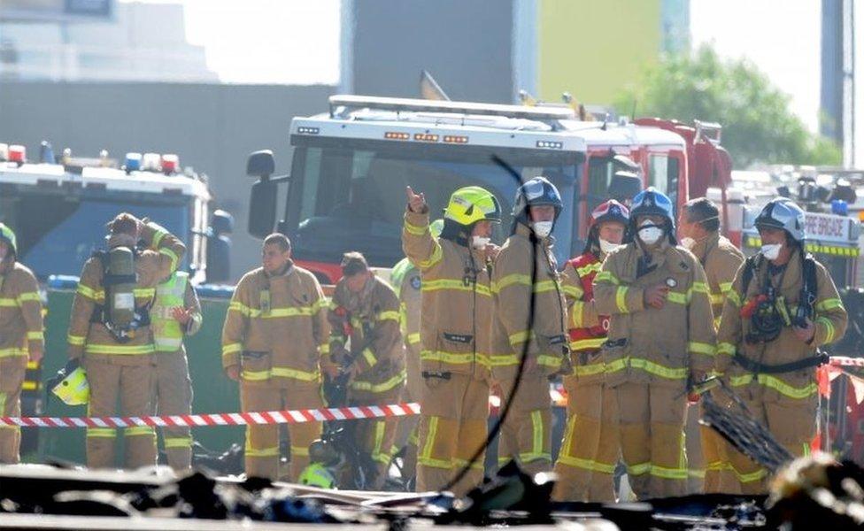 Firefighters at the scene of the crash near Essendon Airport (21 Feb 2017)