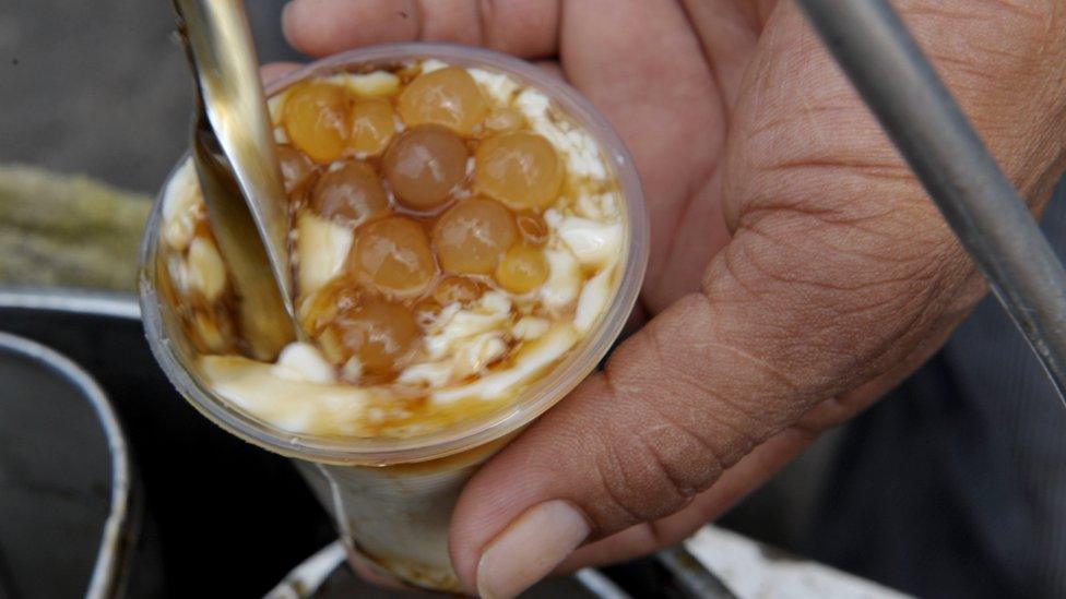 Street vendor Fermin Pangan sells a sweet soya snack locally known in the Philippines as 'taho' in Manila September 2, 2008