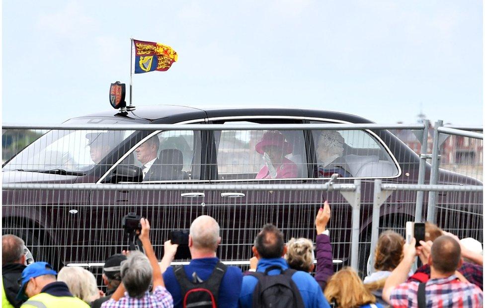 Queen Elizabeth II in a car