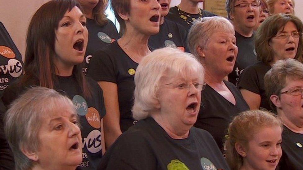 People signing in a choir