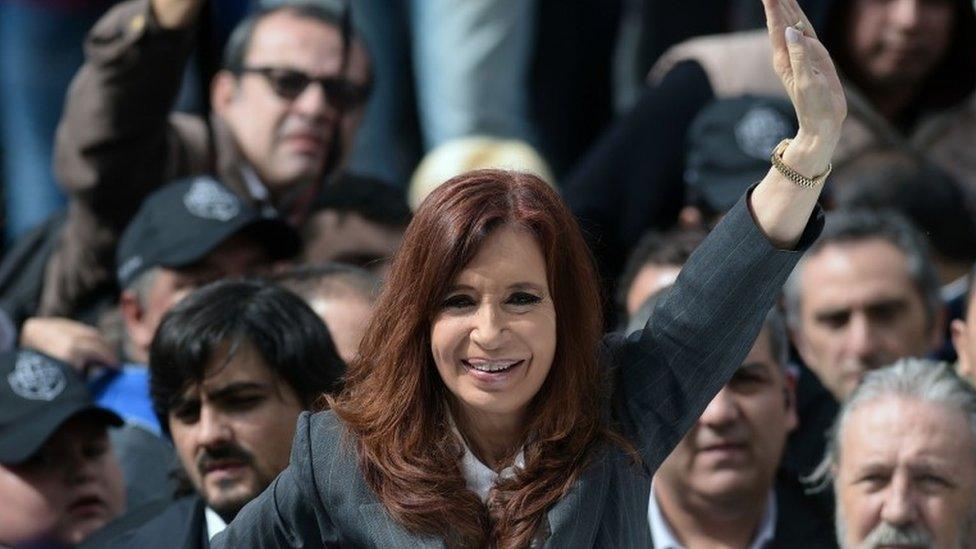 Argentine former president Cristina Fernandez de Kirchner delivers a speech before supporters gathering in front of the Comodoro Py courthouse where she testified before federal judge Claudio Bonadio over corruption allegations, in Buenos Aires on April 13, 2016.