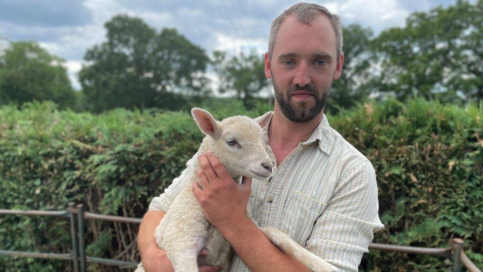 Chris Tilt holding a ewe