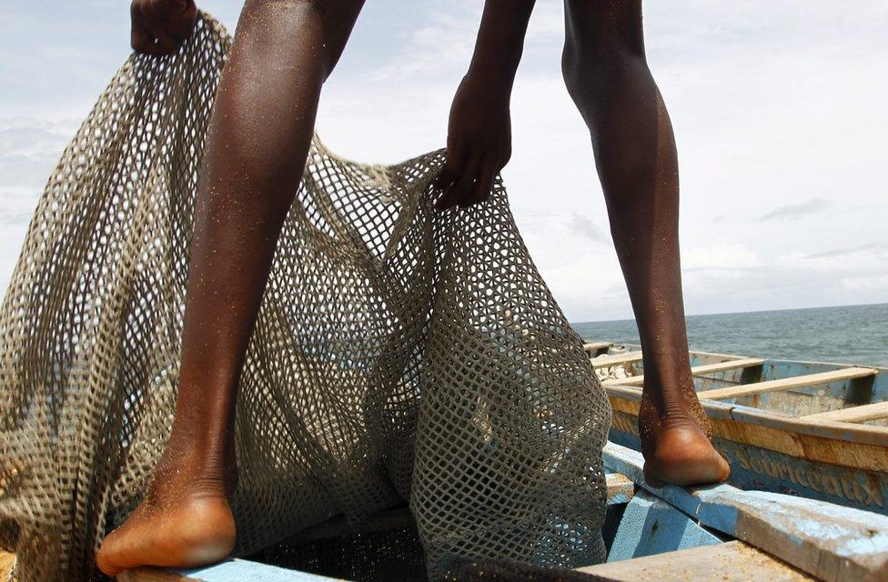 An Ivorian fisherman prepares his fishing nets on a boat in Abidjan, Ivory Coast, 14 May 2016. Reports state that heavy fishing by international companies has put great pressure on traditional fishing communities