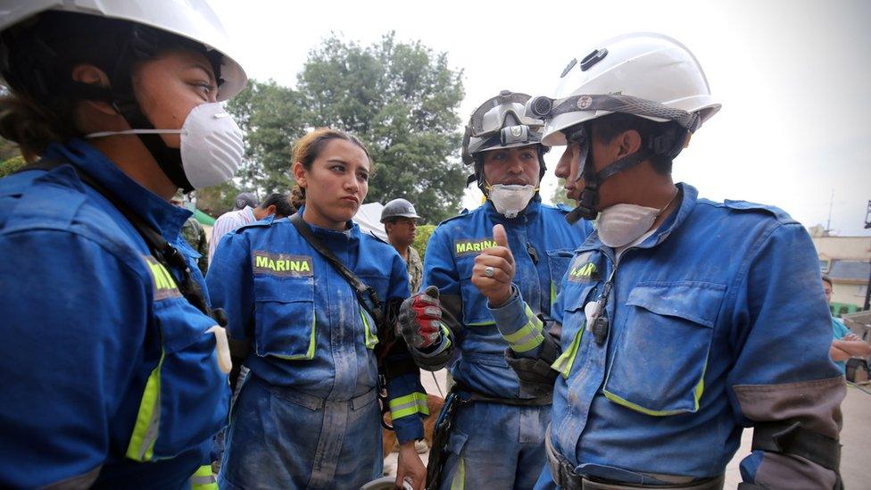 Rescue workers from the Mexican Navy discuss what strategies could be employed to free earthquake survivors, Mexico City, 20 September 2017