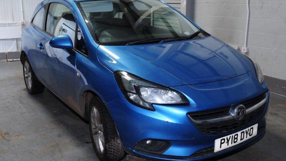 A blue Vauxhall Corsa