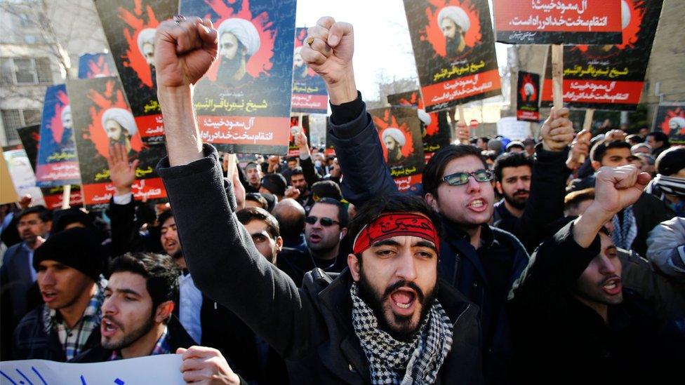 Iranian protestors hold posters of Shia cleric Nimr al-Nimr during a protest near the Saudi embassy in Tehran, Iran on 3 January 2016