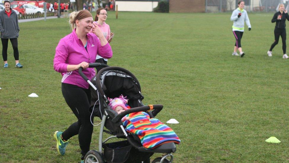 Runners in Little Stoke Park near Bristol