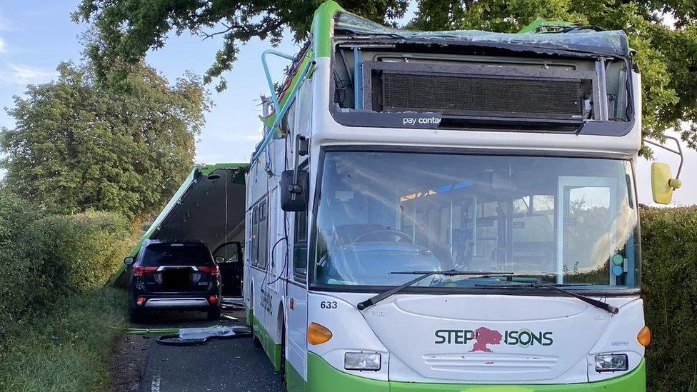 A bus that had its roof ripped off in Clavering, Essex