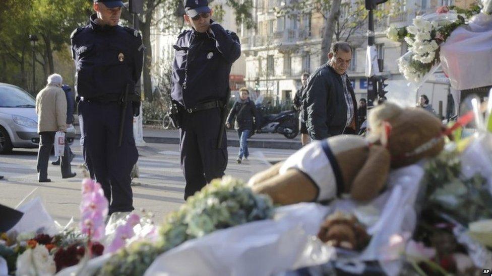 Flowers laid at the site of the attacks on the Bataclan concert venue in Paris