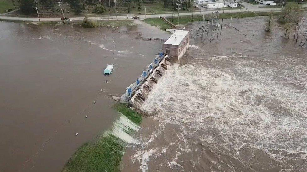 An aerial view of flooding as water overruns Sanford Dam, Michigan