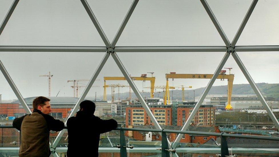 Locals look at Belfast from the observation dome above the Victoria Square shopping development