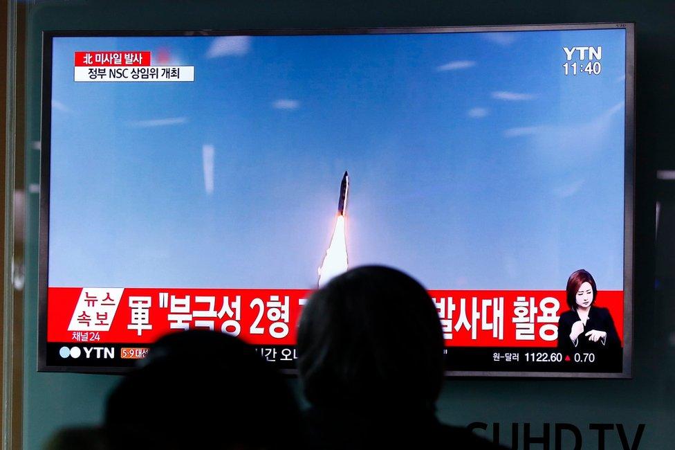 South Korean people watch a televised news broadcast at Seoul Station, in Seoul, South Korea, 05 April 2017