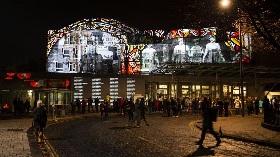 The names of people who were killed in the First World War are projected on to the Scottish Parliament building in Edinburgh