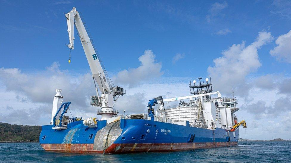 Cable laying ship.