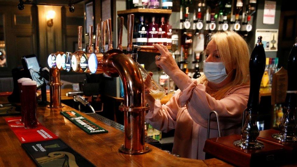 Woman pouring a beer