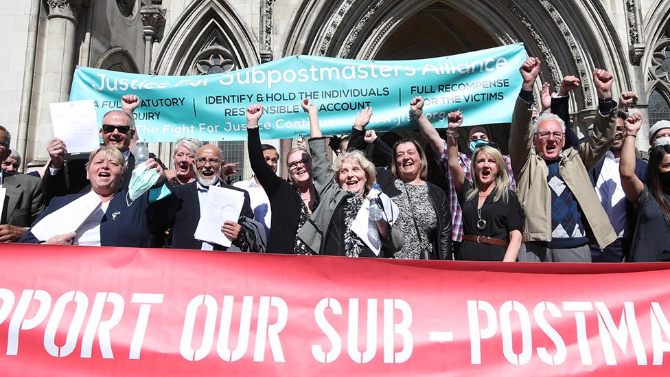 Lorraine Williams, centre left with glasses, and Noel Thomas celebrating outside Royal Courts of Justice in London