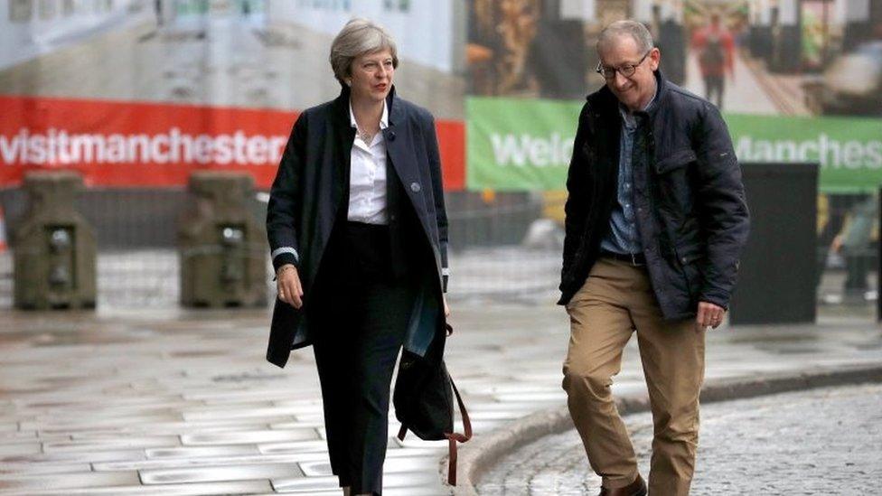 Theresa May and her husband Philip arriving in Manchester