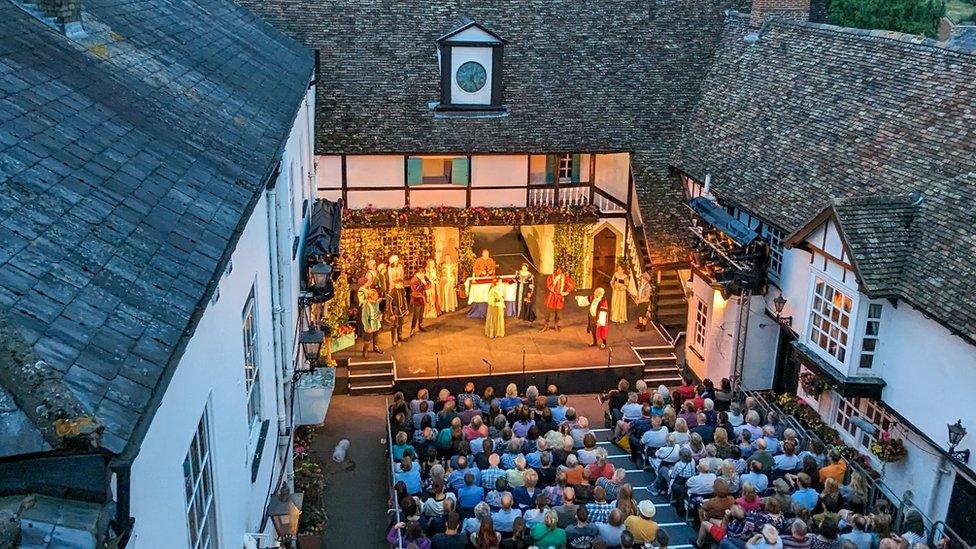 Audience watching actors perform