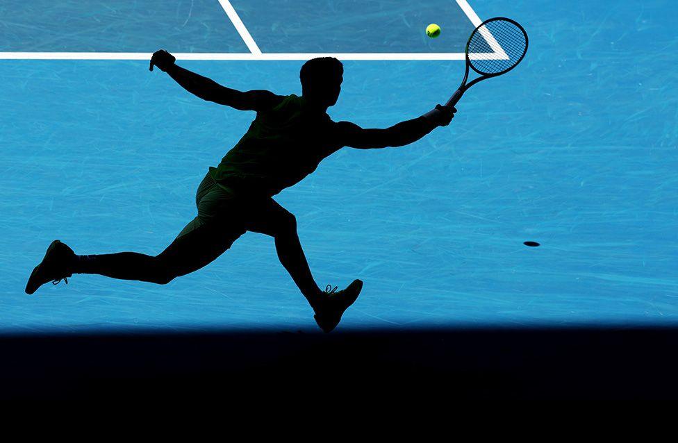 Carlos Alcaraz stretches to return a shot by Tommy Paul in the fourth round of the Australian Open in Melbourne. Photo by Clive Brunskill