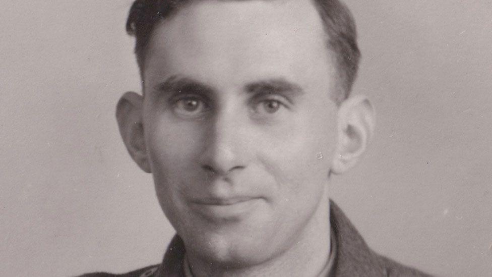 Sgt George Easingwood, of Ely, smiling at the camera. He has a short hair and is wearing an army uniform.