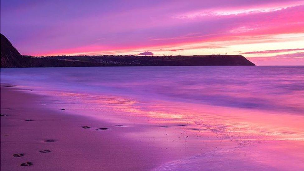 A colourful sunset at Penbryn beach in Ceredigion