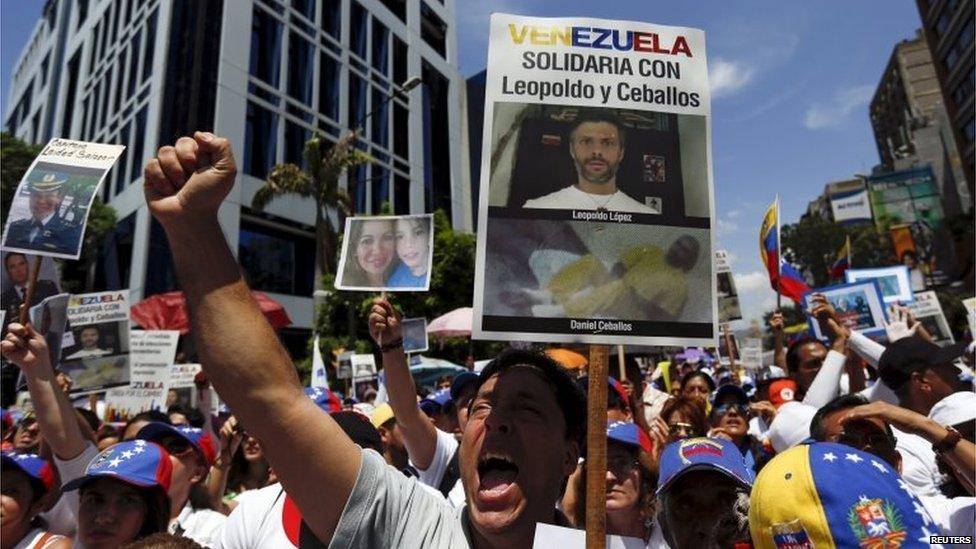 Opposition supporters shout during a rally and in support of jailed opposition leaders in Caracas on 30 May, 2015.