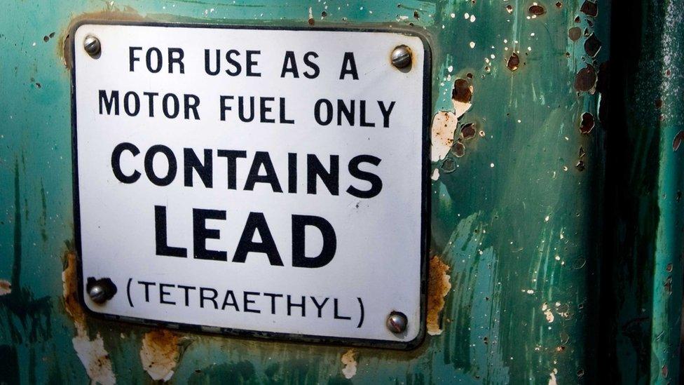 Old petrol pump sign saying "For use as a motor fuel only. Contains Lead (Tetraethyl)