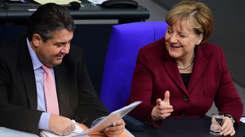 SPD leader Sigmar Gabriel (L) and Chancellor Merkel in Bundestag (lower house), 24 Nov 16